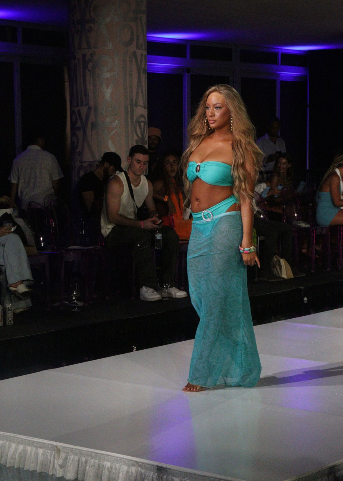 Turquoise bandea bikini with full brief bottoms and sheer patterned skirt