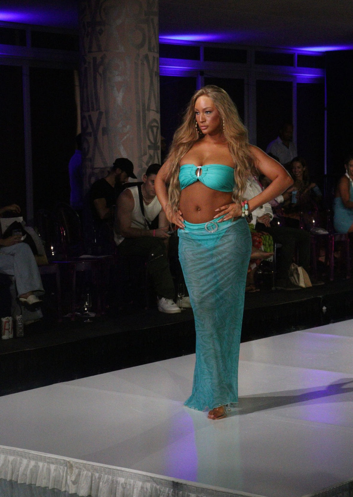 Turquoise bandea bikini with full brief bottoms and sheer patterned skirt